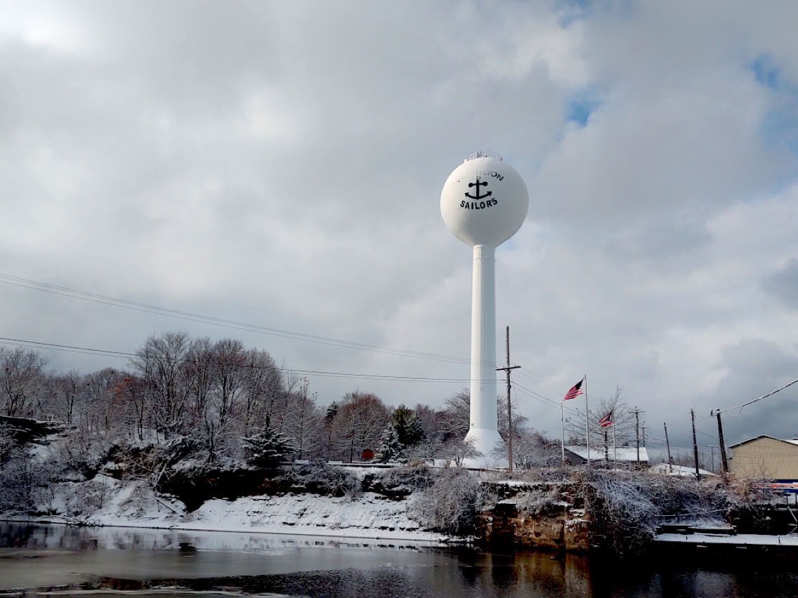 Snowy river with tower